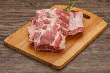 Raw pork ribs served rosemary