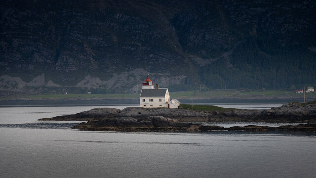 A lighthouse on a rocky island.