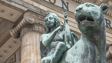 Statue of a panther with genius of music, an angel with wings and a harp, stringed musical...