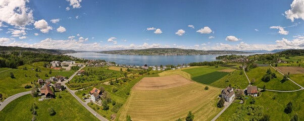 180 panorama with beautiful lake, sky, city and farms located in switzerland