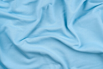 Background from ligt blue monochrome cotton fabric. Close up texture of the fabric is useful as a...