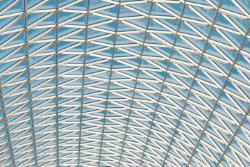 Glass roof of modern building, made triangular pieces, geometric shapes.