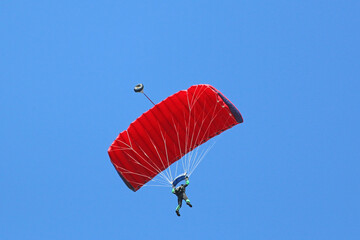 Skydiver in a blue sky	