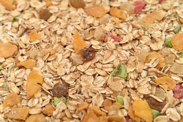 Muesli with oats, cornflakes and candied tropical fruit. Healthy breakfast. Close-up. Selective focus.