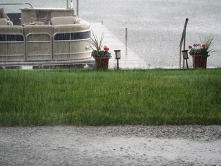A Rainy Lake Day with Dock Boat and Lake