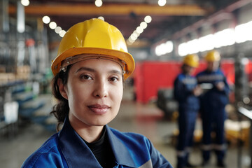 Portrait of mixed race woman working at factory