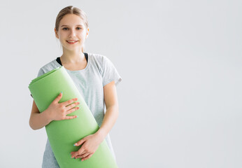 Fitness accessories. Active kids. Fitness training equipment. Smiling satisfied athletic girl...
