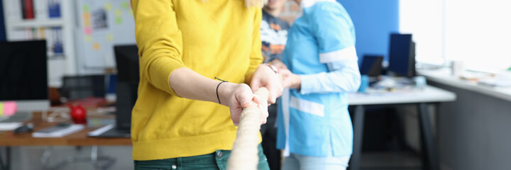 Group of people pulling rope in office closeup © megaflopp