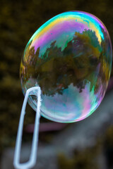 Reflect of a colorful soap bubble in outdoor