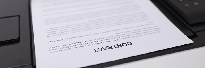 Fototapeta premium Contract document is printing on printer closeup