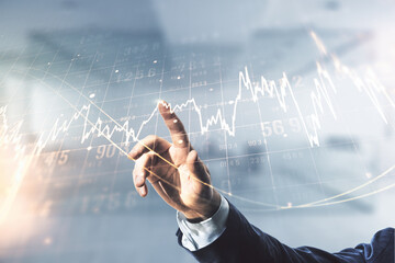 Multi exposure of analyst hand with pen working with virtual abstract financial diagram on blurred...