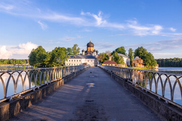 bridge over the lake to the monastery on the island. Vvedensky Monastery. Pokrov. Vladimir region. Russia