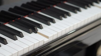 Grand piano. Professional piano keys self playing. close-up seamless loop. for classical musical music education. Black and white piano keys that play on their own. AI Self Playing Without Pianist.