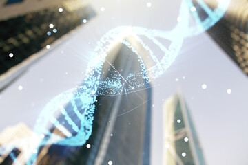 Double exposure of creative DNA hologram on modern skyscrapers background. Bio Engineering and DNA...