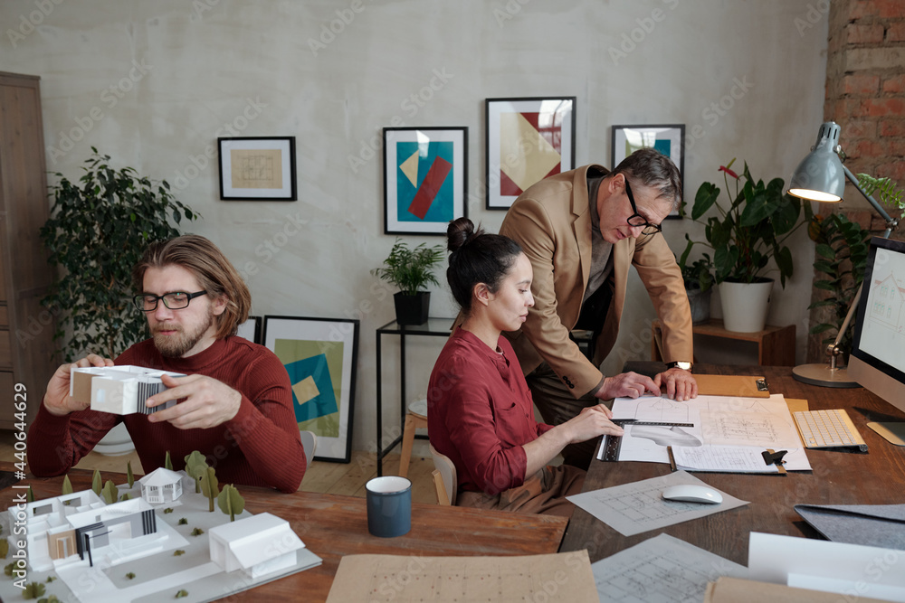 Wall mural Architects working in office