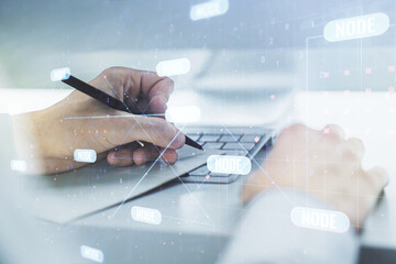 Multi exposure of abstract software development hologram and hand writing in notebook on background with laptop, research and analytics concept