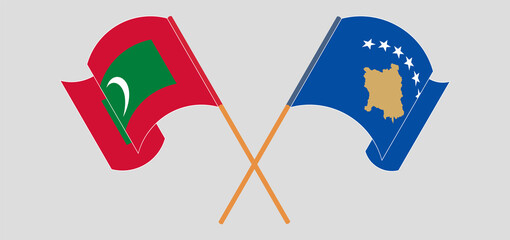 Crossed and waving flags of Maldives and Kosovo