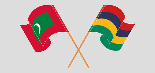 Crossed and waving flags of Maldives and Mauritius