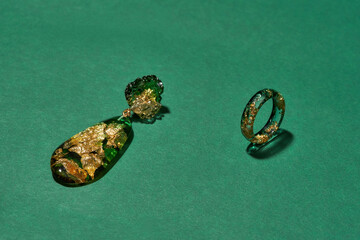 Stylish set of handmade ring and dangle earring made of epoxy resin with golden foil inside...