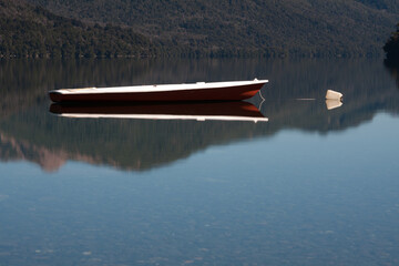 Boat canoe on a calm lake