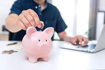 Saving money with piggy bank concept
