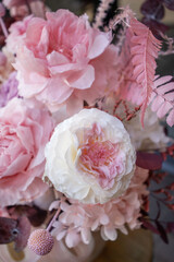 Preserved roses with dried flowers bouquet closeup. Eternal, stabilized, forever rose flower. Beautiful flowers.