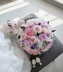 Stylish bridal bouquet of preserved flowers. Bride bouquet in delicate pink and white tones, mix roses.