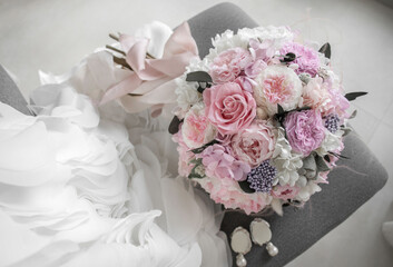 Stylish bridal bouquet of preserved flowers. Bride bouquet in delicate pink and white tones, mix roses.