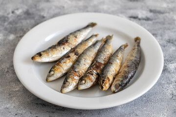 fried sardines on white dish