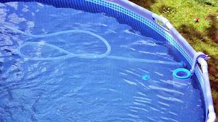 Cleaning bottom of swimming pool by underwater vacuum cleaner