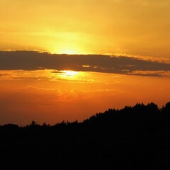 Beautiful sunset with dark clouds and orange sky