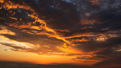 Fototapeta na wymiar dramatic raging menacing sunset