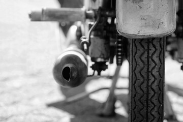 Old moped rear view, tailpipe, black and white