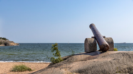 Old cannons left to coastline to remind of military past of Hanko, Finland.
