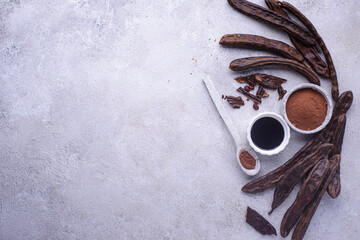 Carob pods, powder and molasses or syrup