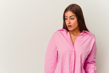 Obraz premium Young caucasian woman isolated on white background being shocked because of something she has seen.