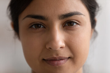 Crop close up portrait of young Indian woman with healthy skin, no makeup natural face look....