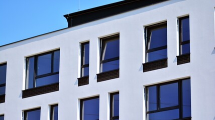 Modern apartment building in sunny day. Exterior, residential house facade.