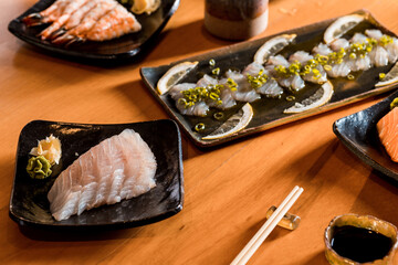 Delicious Sushi Menu Food Sashimi Salmon Tuna Shrimp Hashi Holds Gourmet Plate Restaurant Wooden Table
