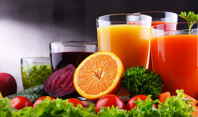 Glasses with fresh organic vegetable and fruit juices