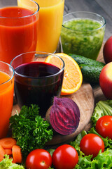 Glasses with fresh organic vegetable and fruit juices