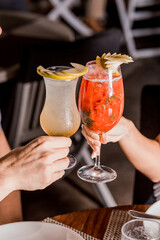 Couple Cheers Drink Toast Holding Glass Red Strawberry  Green Apple Garnish Recipe Menu Restaurant Night Love