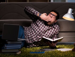 Student reading books preparing for exams