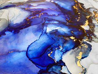 Abstract blue background with gold — beautiful smudges and stains made with alcohol ink and...