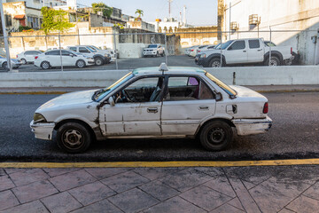 Run down taxi in Santo Domingo, capital of Dominican Republic.