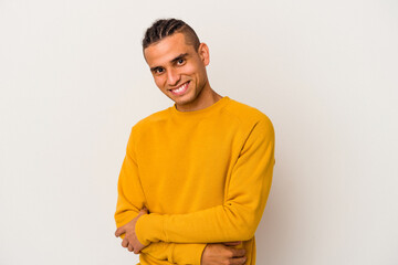 Young venezuelan man isolated on white background unhappy looking in camera with sarcastic expression.