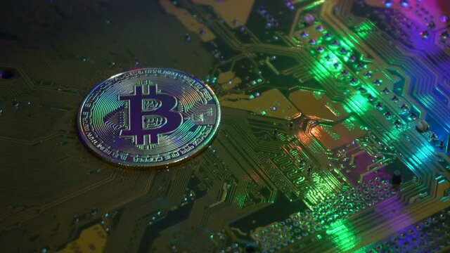 Golden bitcoin coin on server computer motherboard It is the currency that is exchanged and popular today in every country in the world. Concept business technology. Copy spece background