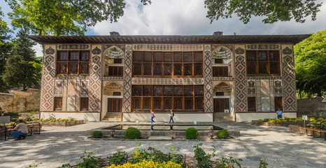 Fototapeta na wymiar SHEKI, AZERBAIJAN - JUNE 11, 2018: Palace of Khans (Xan Sarayi) at Sheki fortress, Azerbaijan