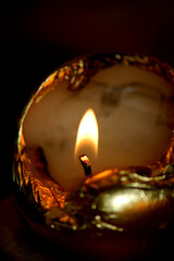 burning candle in the dark