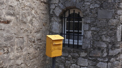 A yellow mailbox